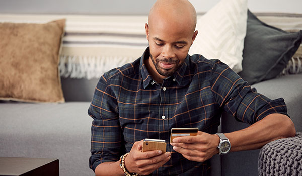 Man paying with card by phone